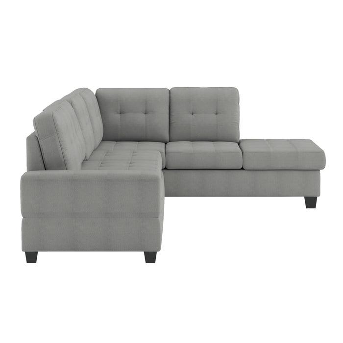 Maston - (3)3-Piece Reversible Sectional with Drop-Down Cup Holders and Storage Ottoman