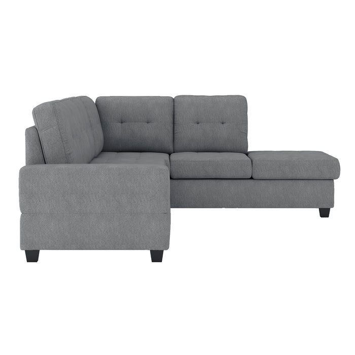 Maston - (3)3-Piece Reversible Sectional with Drop-Down Cup Holders and Storage Ottoman